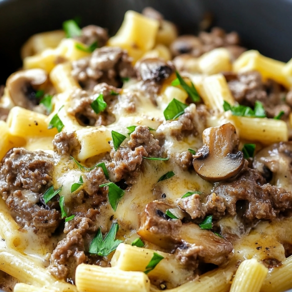 Philly cheesesteak pasta with ground beef, mushrooms, melted cheese and parsley