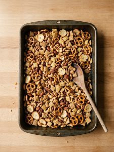 Step 4: Three kinds of Chex, nuts, pretzels, and bagel chips evenly coated in seasoned butter.