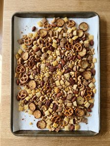 Step 6: Baked Chex mix spread out on paper towels to cool completely.