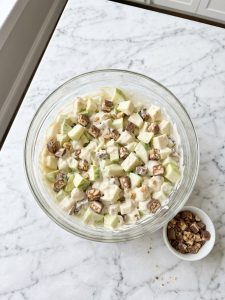 Step 5: Chopped Granny Smith apples and Snickers evenly coated in the creamy base.