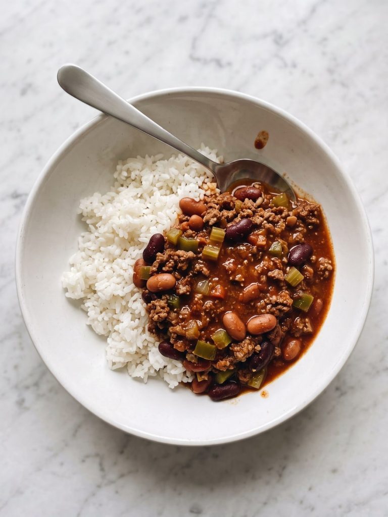 A bowl of Hawaiian-style chili with beans ladled over white rice