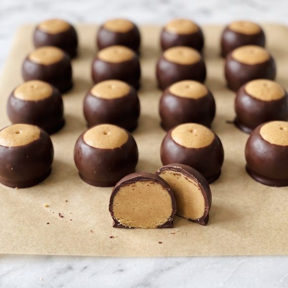 Rows of buckeye candies: peanut butter balls dipped in chocolate with the tops left bare